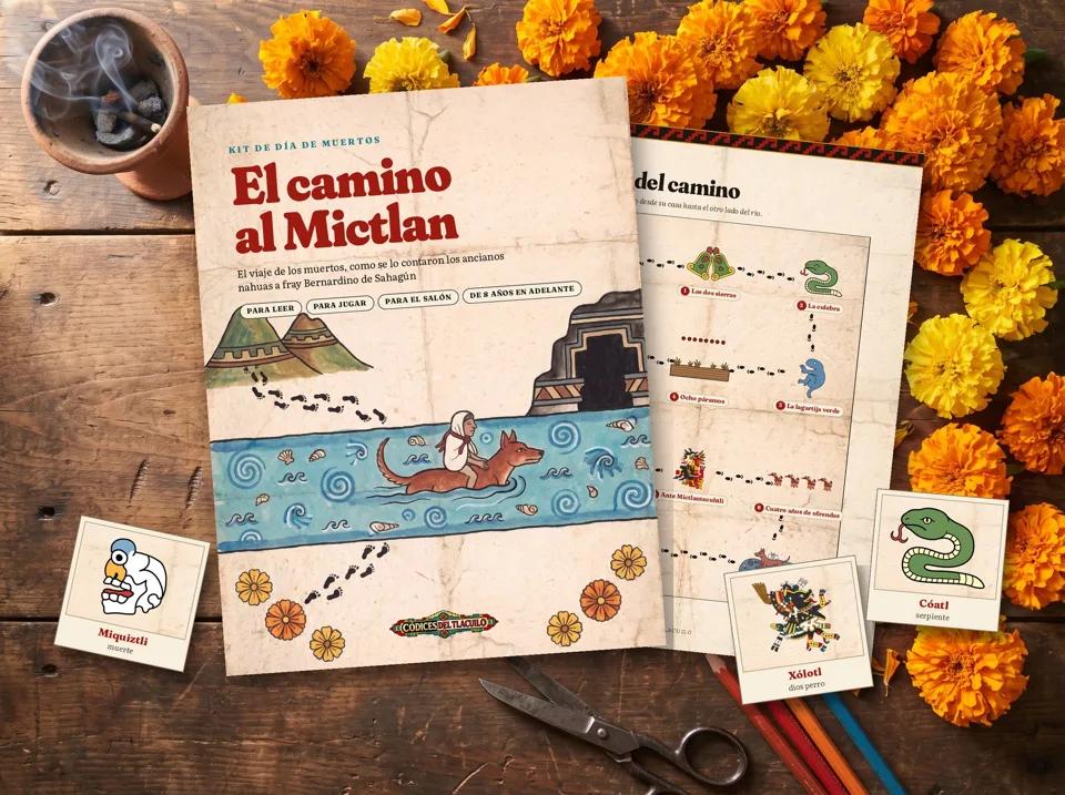 Páginas del kit El camino al Mictlan sobre una mesa con cempasúchil